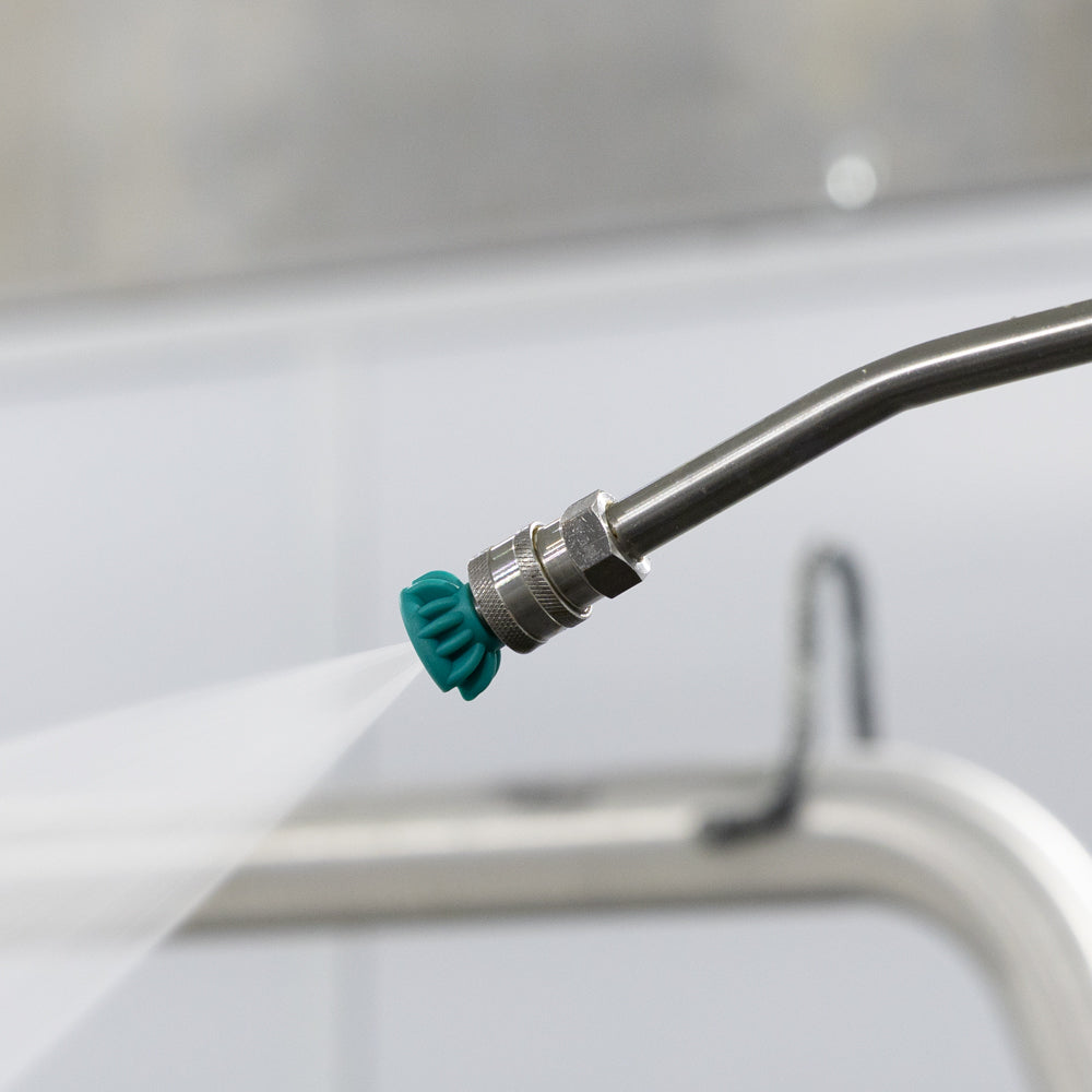 Tecomec 25 degree green ceramic nozzle in use on a pressure washer