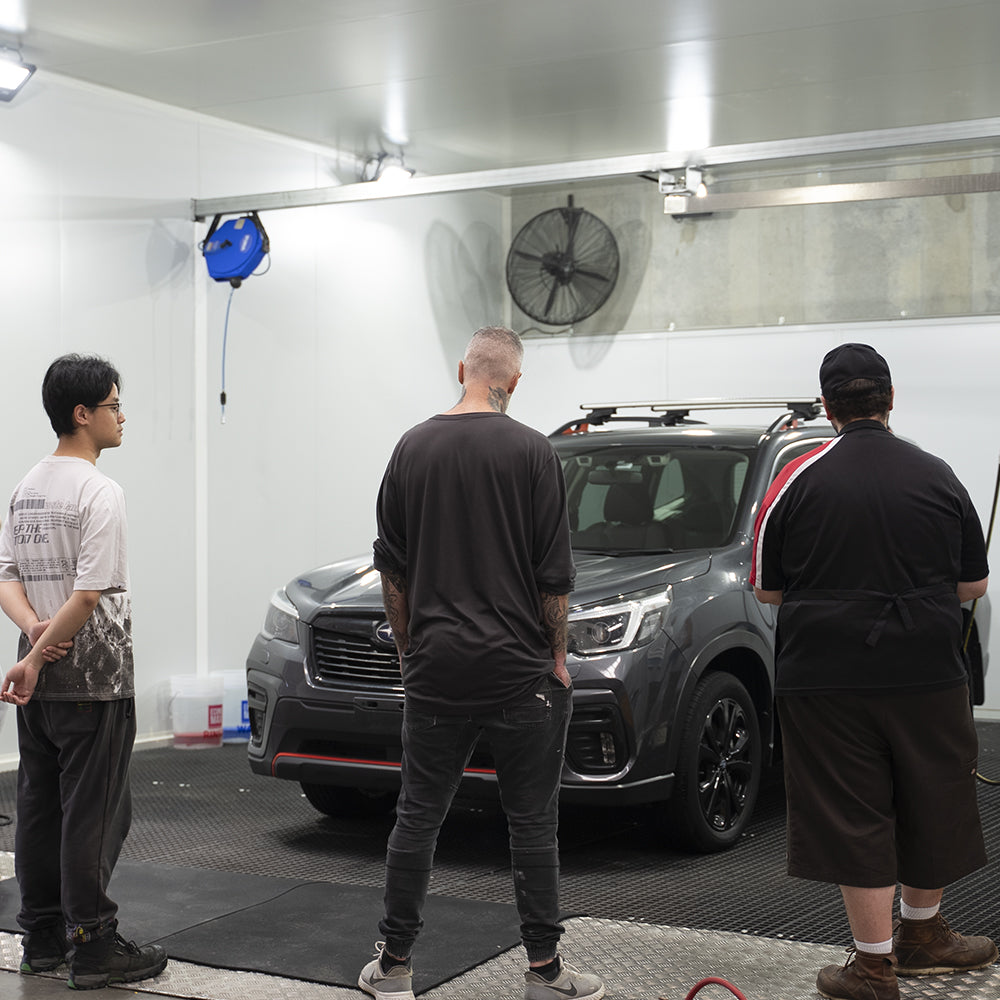 Teacher with student during a waxit course