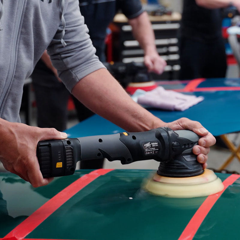 Students using ShineMate Machines on panels