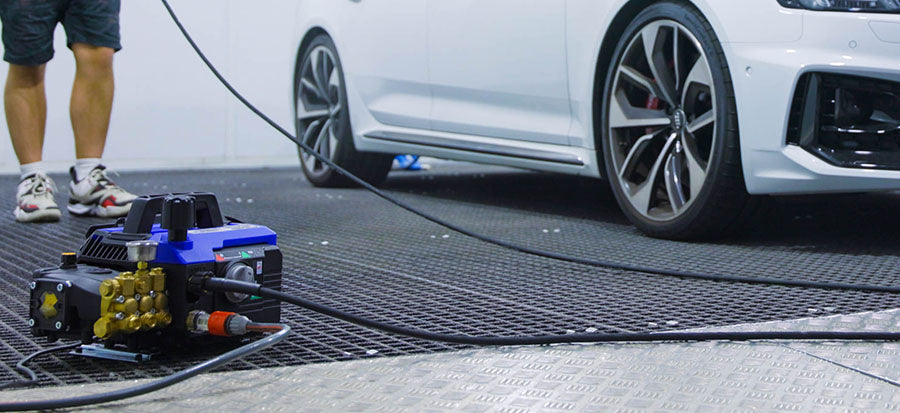 Annovi Reverberi 630 Pressure Washer being used with a white car in the background