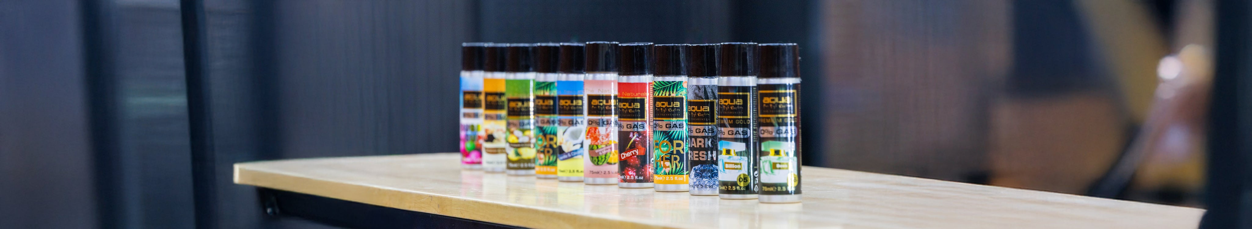 Aqua Aroma spray cans lined up.