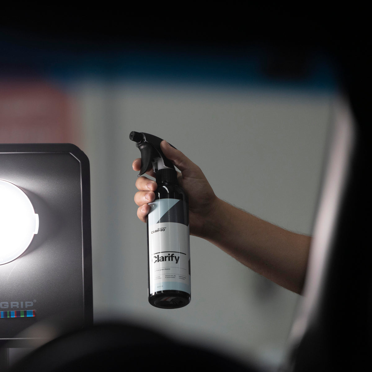 CARPRO Clarify glass cleaner in use on car glass
