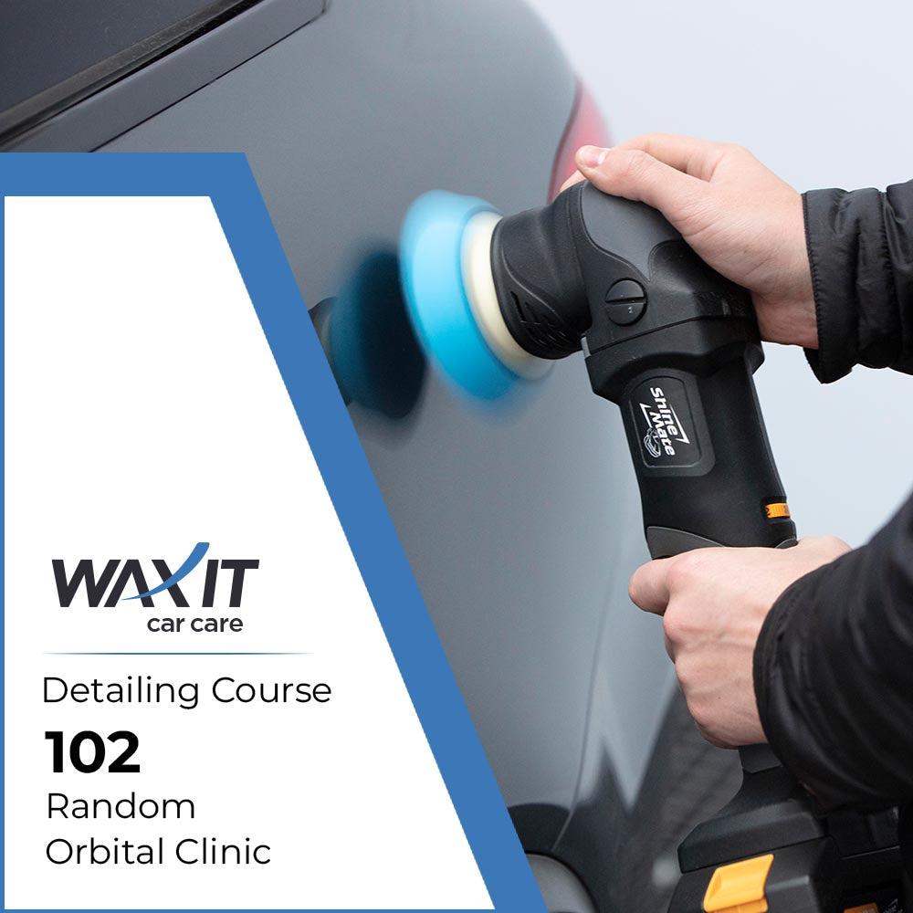 Detailing Course 102 with someone polishing black car in the background