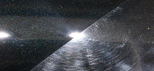 Polishing 50 50 on a black car