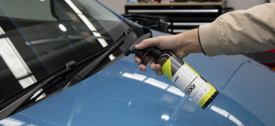 CARPRO Elixir spraying on blue car