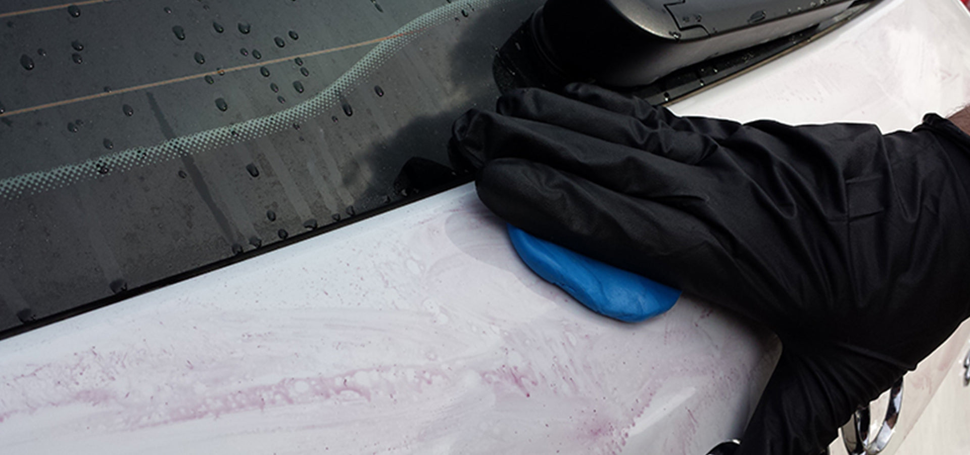 Clay baring a white car