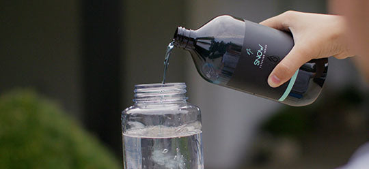 Pouring Nv snow into NV Snowstorm bottle