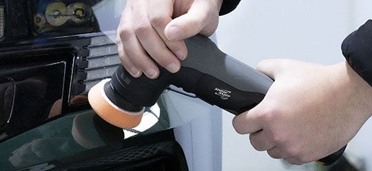 ShineMate EB210 about to start polishing a green car