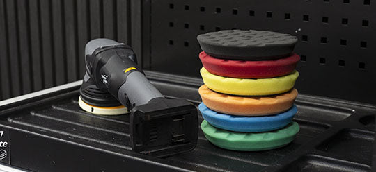 ShineMate Polisher and 6 pads on a bench