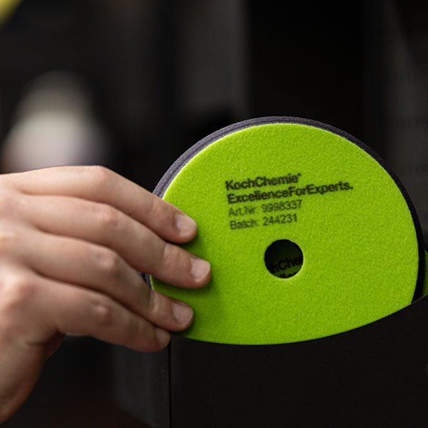 Koch Chemie Polish & Sealing Pad being put into an Economax pad holder