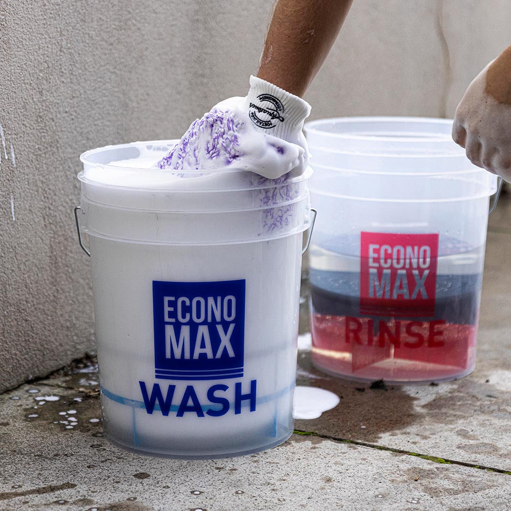 Dipping Aquatouch Boss Mitt into bucket full of snow foam