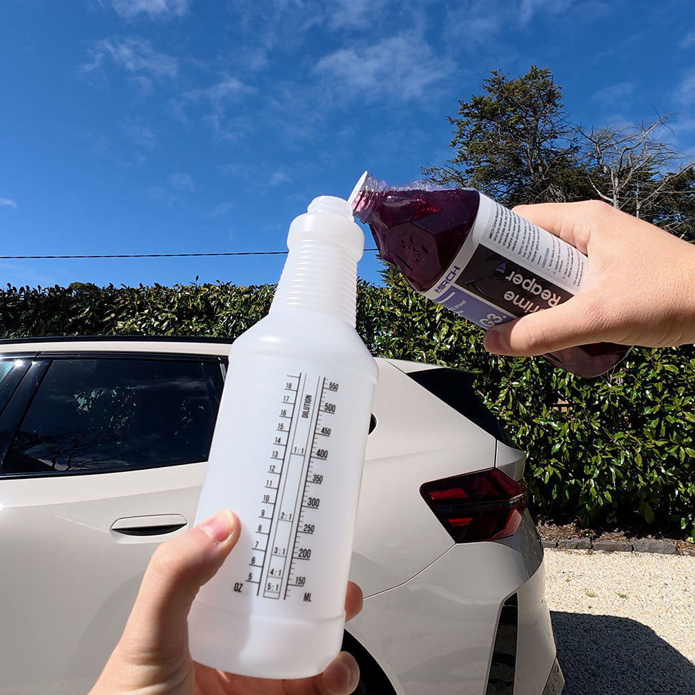 Pouring MIRCH Grime Reaper into an Economax Dilute Spray Bottle