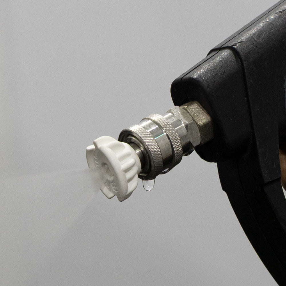 Tecomec 40 degree white ceramic nozzle in use on a pressure washer
