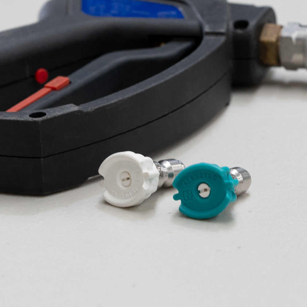 Tecomec ceramic 1/4" QC nozzle in use on a pressure washer
