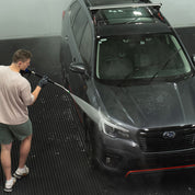 rinsing Black Car with MTM short gun and lance