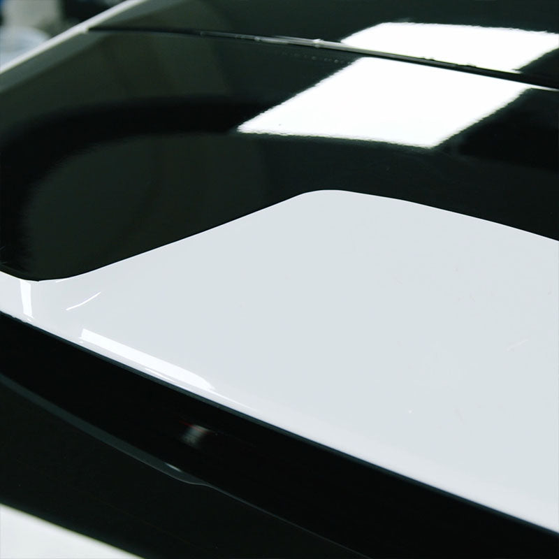 CARPRO Immortal Gloss on a white car