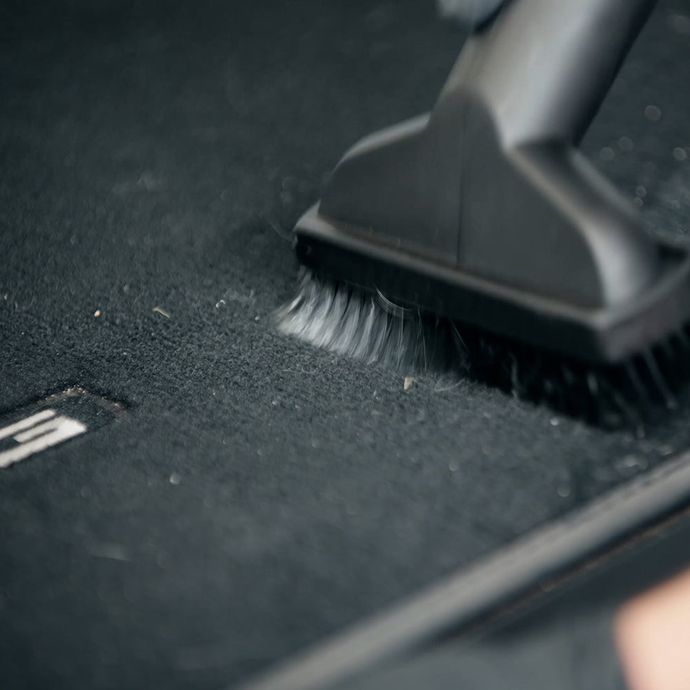Vacuuming car carpet