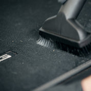 Vacuuming car carpet