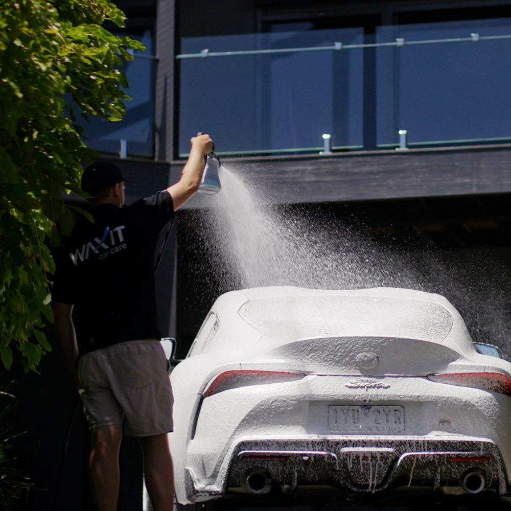 Waxit Car Care staff using foam cannon spraying Toyota Supra