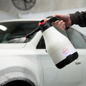 Aquatouch Arctic Foam Gun spraying a thick blanket of foam onto a white car.