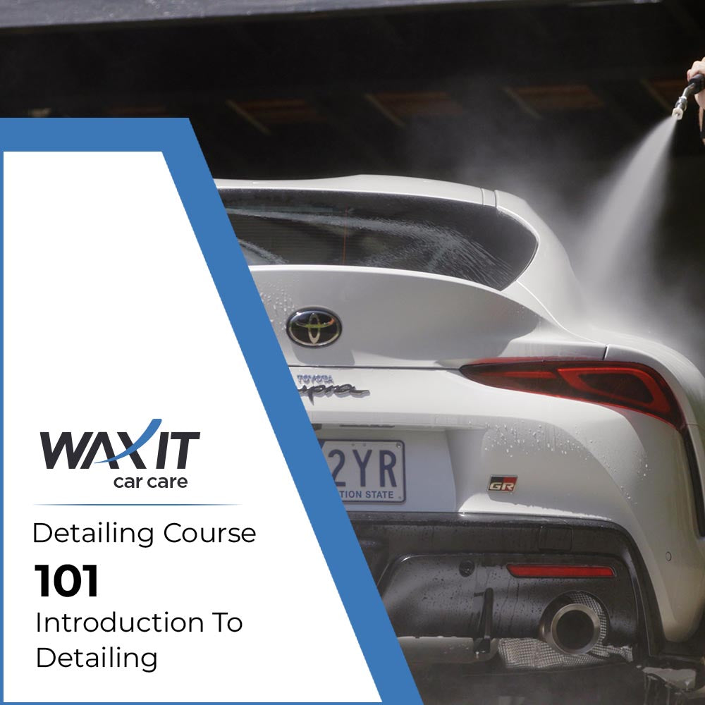 Introduction to Detailing 101 course banner with a white car being rinsed in the background