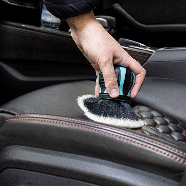 Detail Factory Curveball brush cleaning a car interior