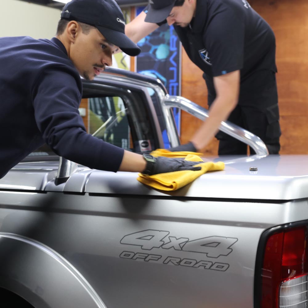 People from the training wiping down a panel