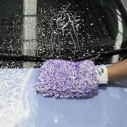 Handing washing blue car with BOSS