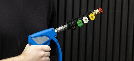 A person holding a MTM Azzuro Short Gun and nozzle holder attachment