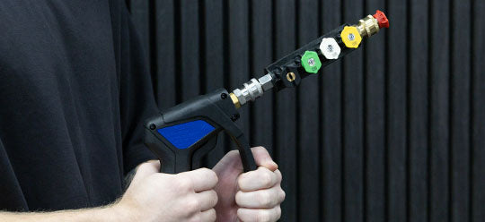 A person holding a MTM Short Gun and nozzle holder attachment