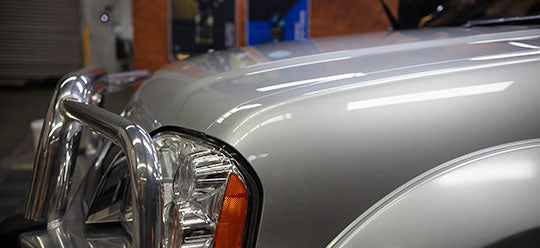 Close up shot of a glossy Nissan Navara bumper and bullbar