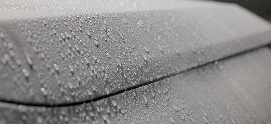 Beading on a silver car