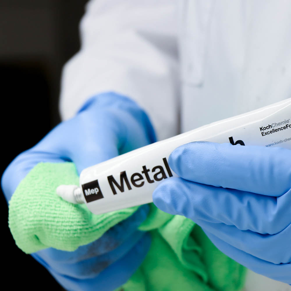 Koch Chemie Metal Polish being squeezed onto a microfiber cloth.