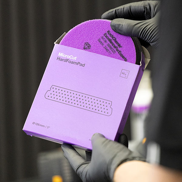 Koch Chemie Micro Cut Hard Foam Pad being removed from its box