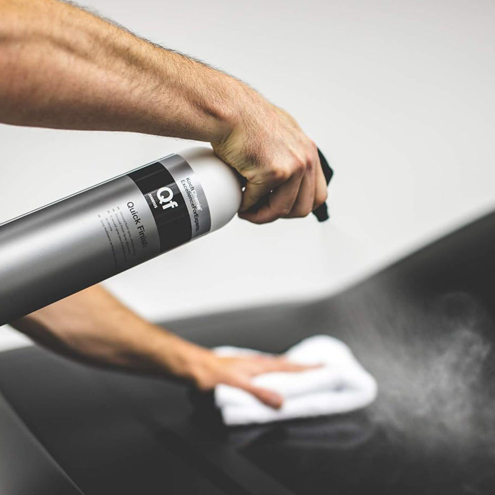 Koch Chemie Quick Finish 1 L bottle being sprayed onto a black car