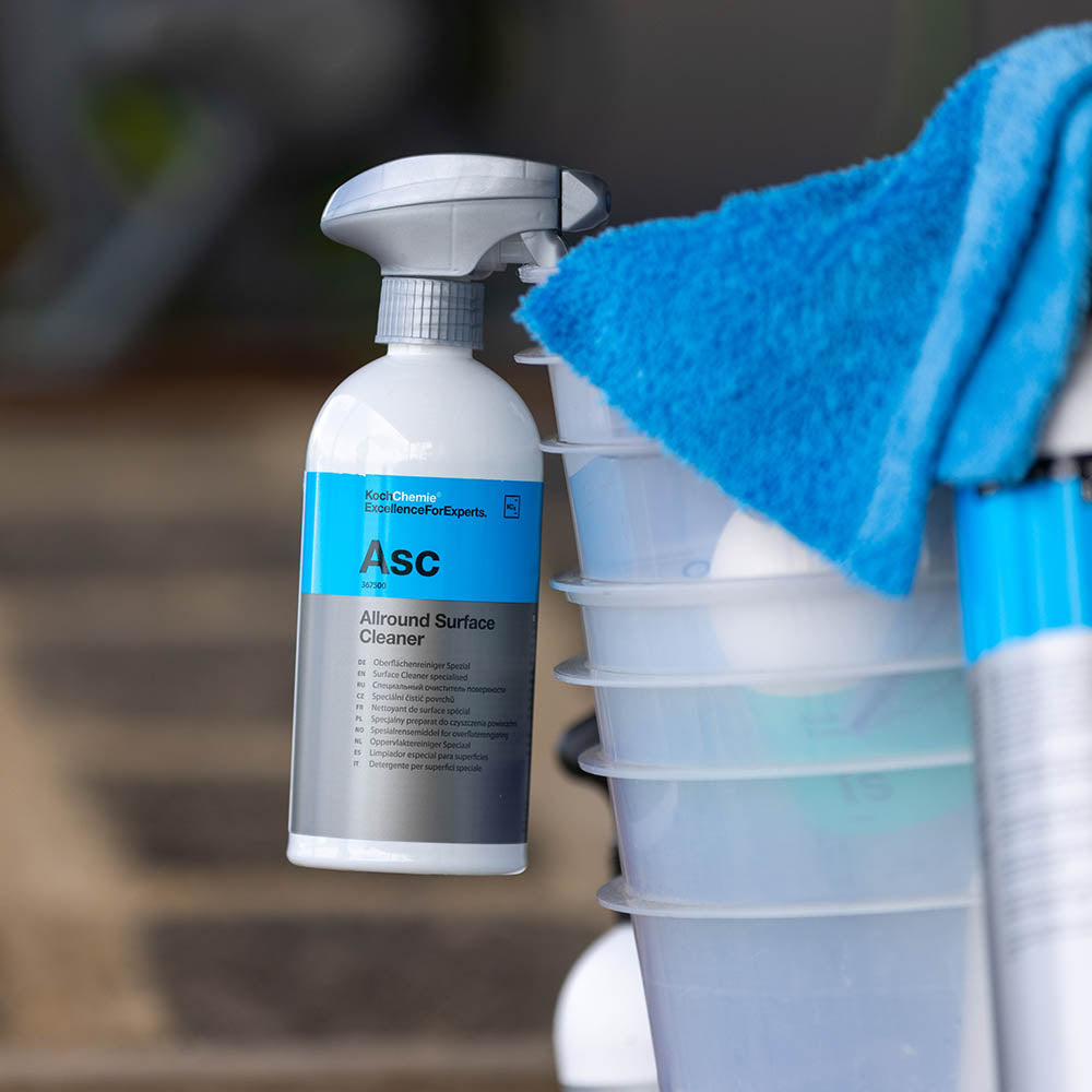 Koch Chemie Allround Surface Cleaner (ASC) 500 mL bottle resting on a wash bucket