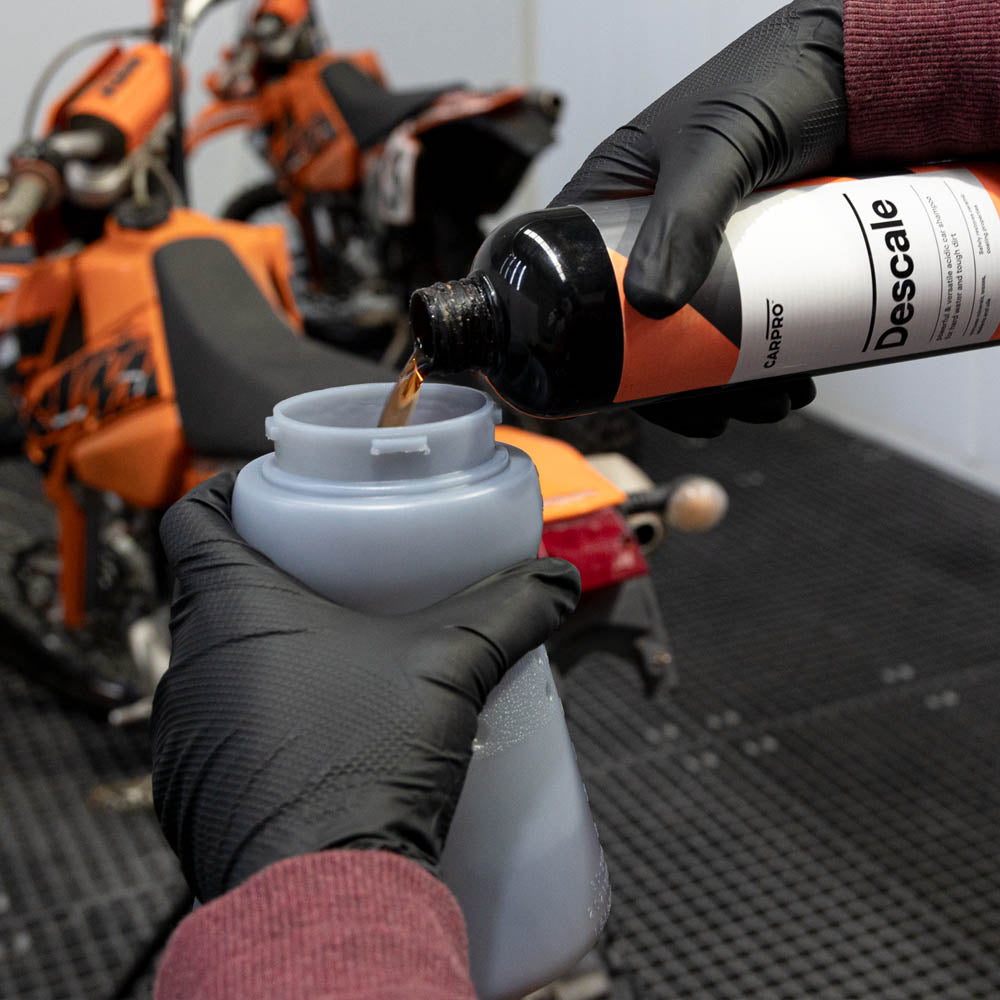 Carpro Descale being poured into the MTM Foam Cannon Wide Mouth
