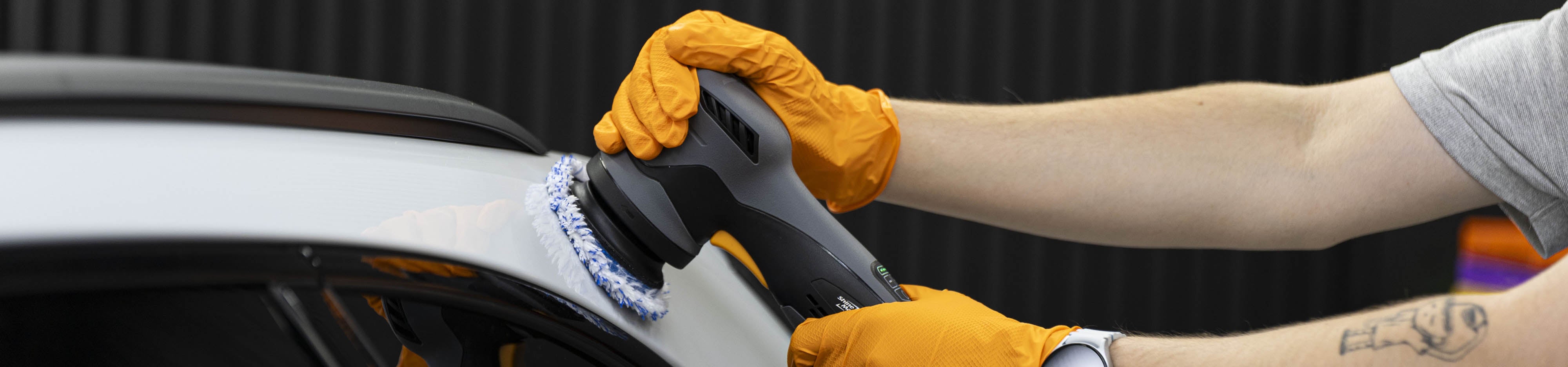 Person using shinemate polisher eb213 about to polish white car