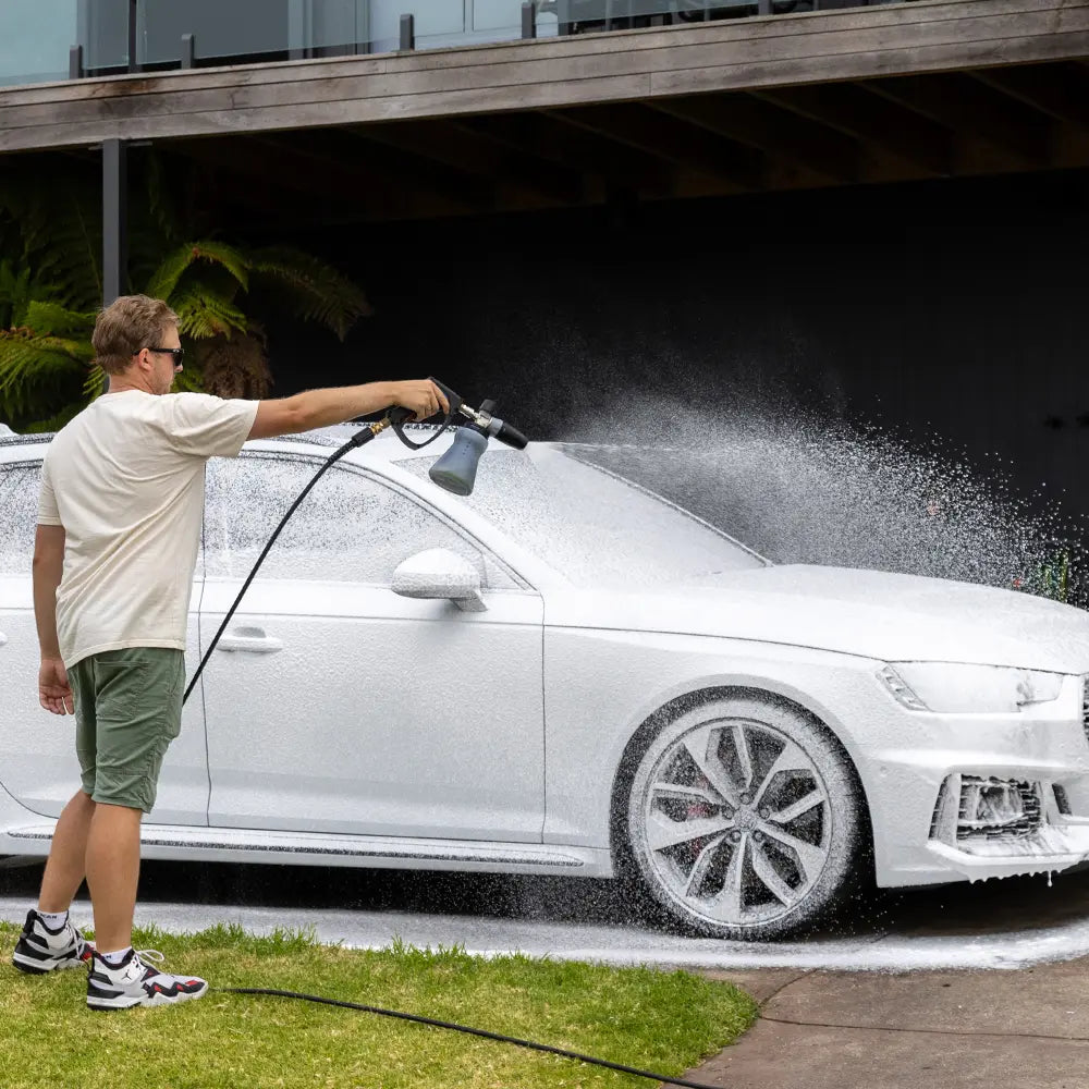 Foaming up white car with MTM foam cannon