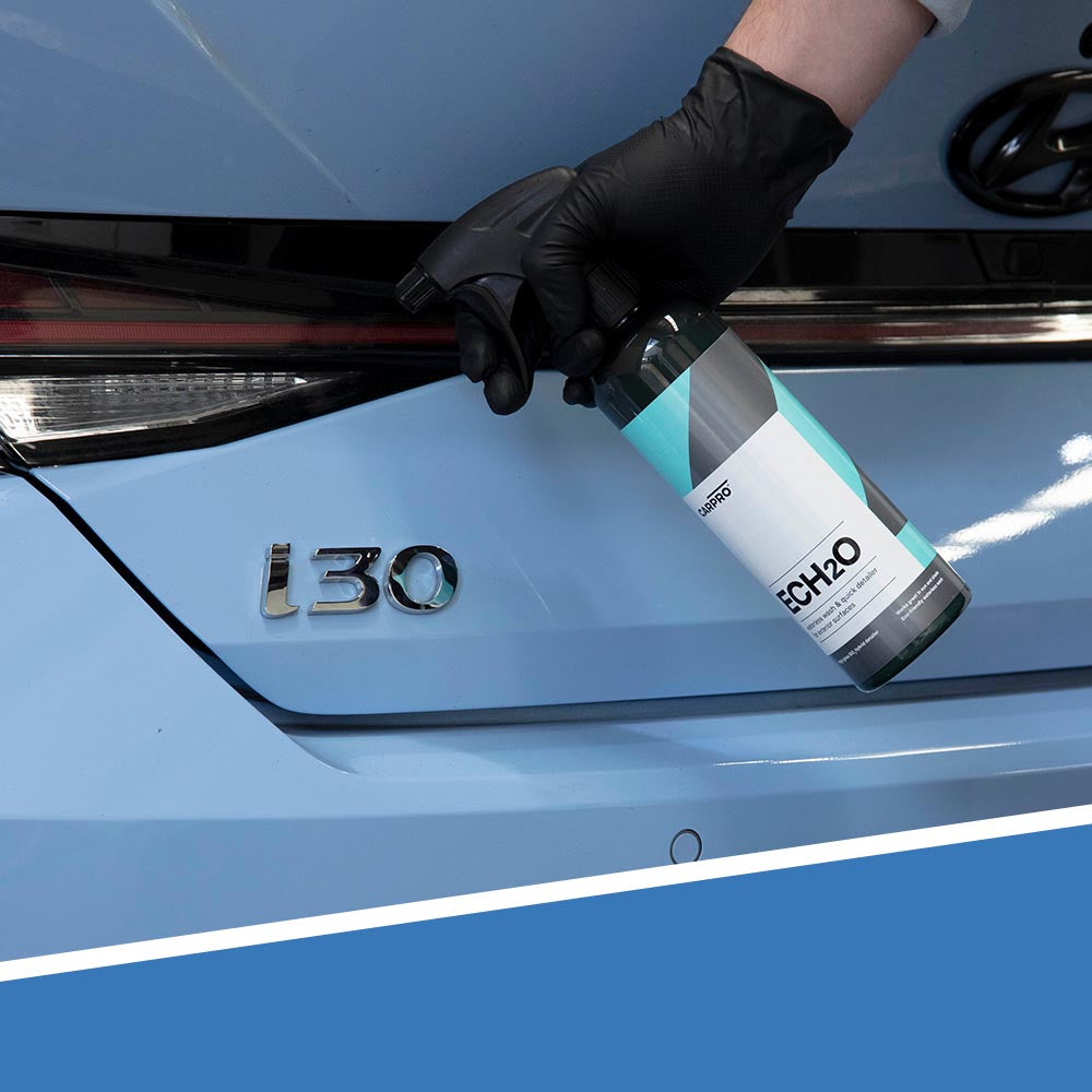 CARPRO Ech2O spraying on blue car